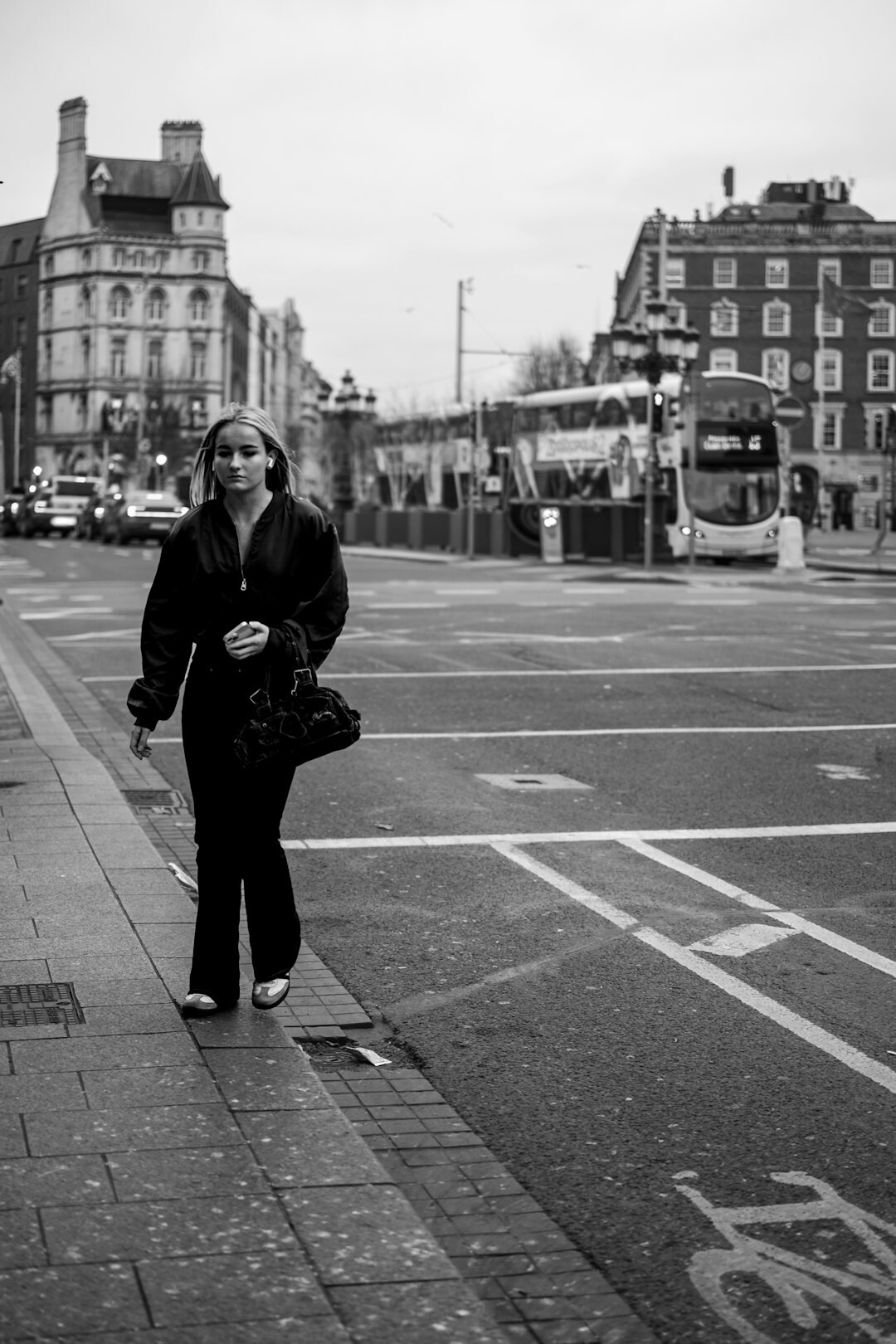 Documentary photographer holding a camera in an urban street